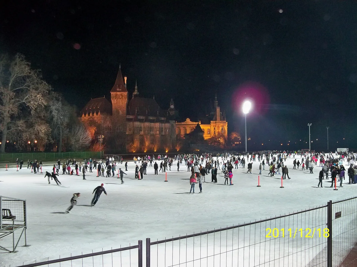The City Park Ice Rink at night by Vajdahunyad Castle, open during the Budapest Christmas market dates
